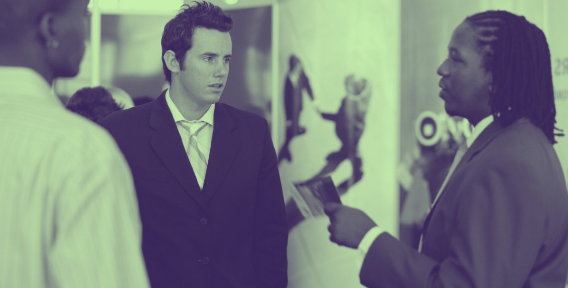 People talking at exhibition.